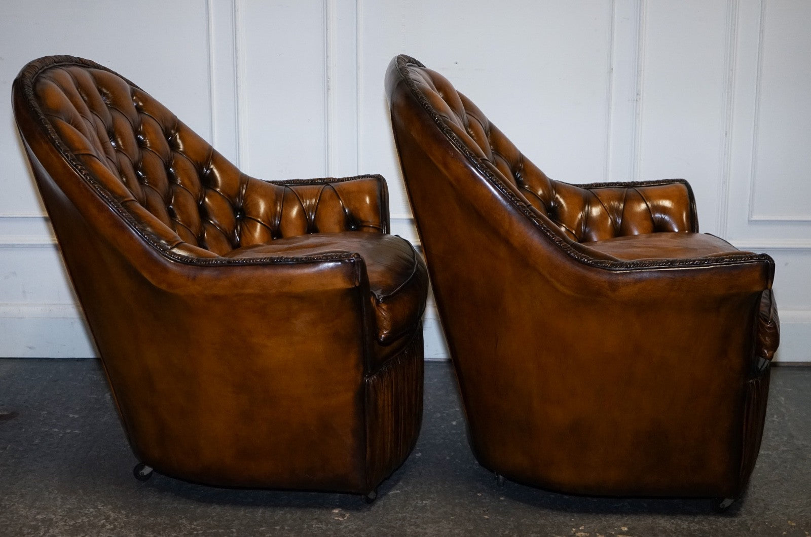 RARE PAIR OF BROWN HAND DYED LEATHER CHESTERFIELD ARMCHAIRS WITH PLEATED FRONT