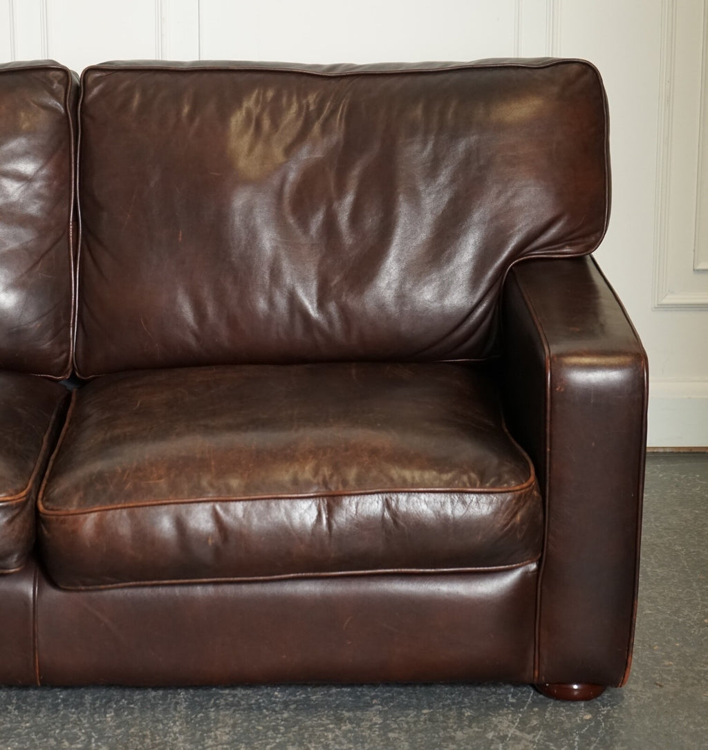 VINTAGE DISTRESSED BROWN LEATHER TWO TO THREE SEATER SOFA