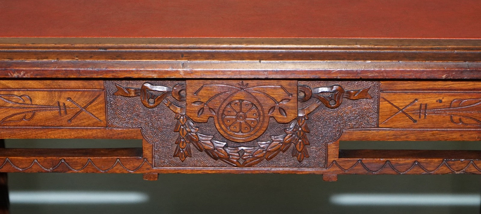LATE 19TH CENTURY CONTINENTAL CARVED WALNUT WRITING TABLE LEATHER INLAY TOP