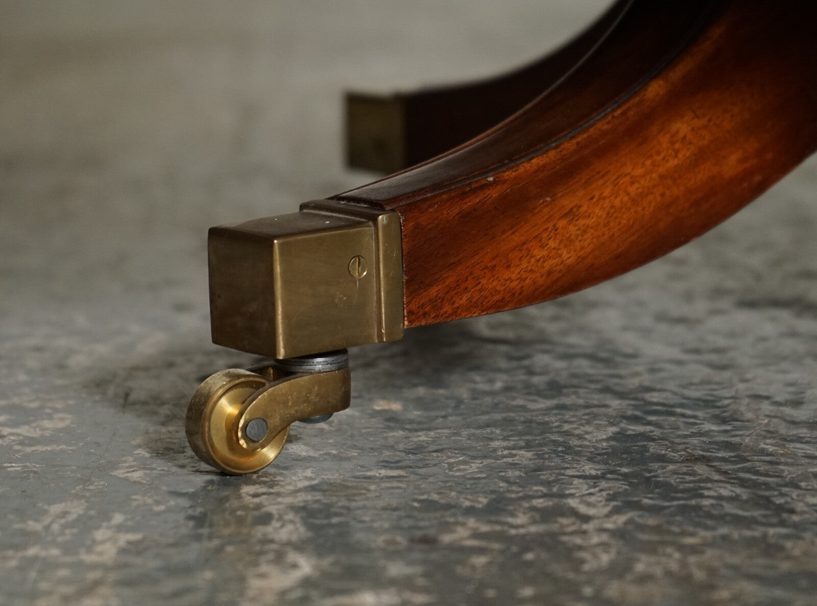 BEVAN FUNNEL REVOLVING BOOKCASE END TABLE RAISED ON BRASS CASTORS