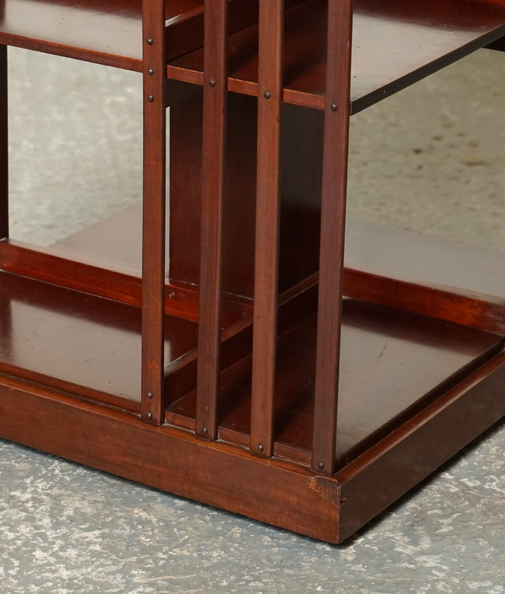 ANTIQUE EDWARDIAN REVOLVING BOOKCASE WITH A SERPENTINE SHAPED TOP