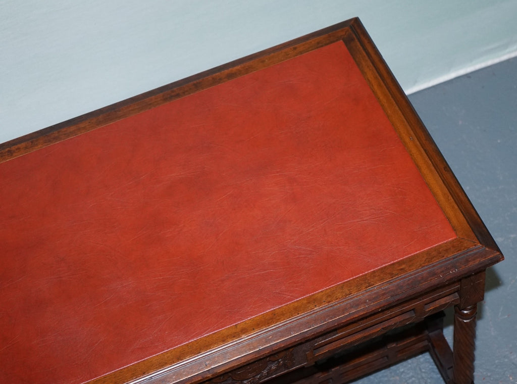 LATE 19TH CENTURY CONTINENTAL CARVED WALNUT WRITING TABLE LEATHER INLAY TOP