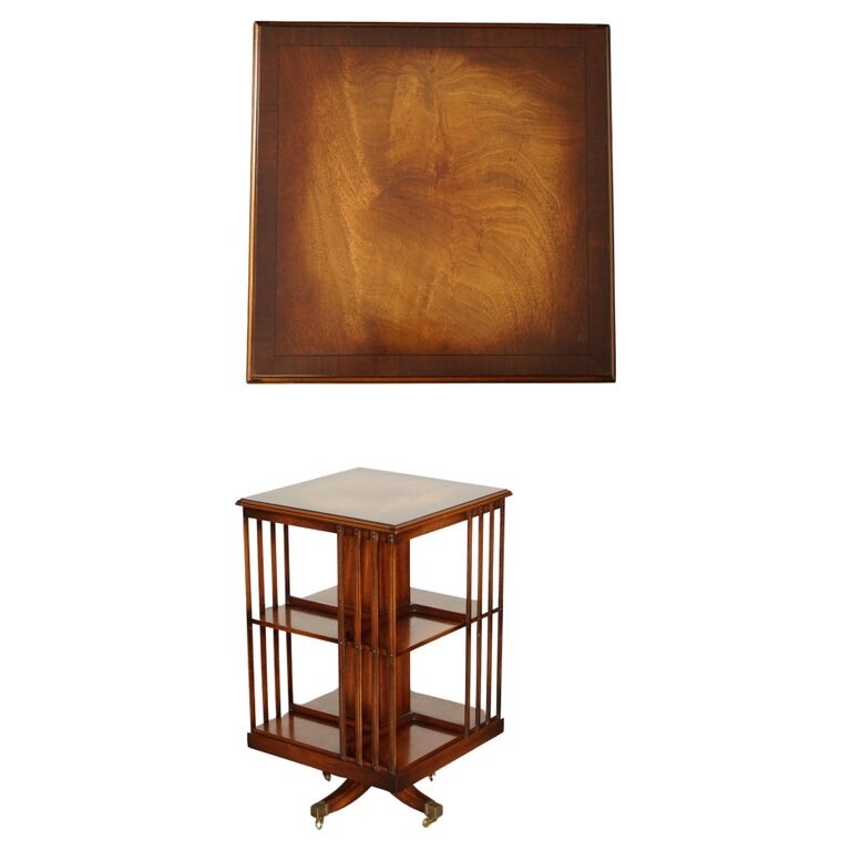 BEVAN FUNNEL REVOLVING BOOKCASE END TABLE RAISED ON BRASS CASTORS