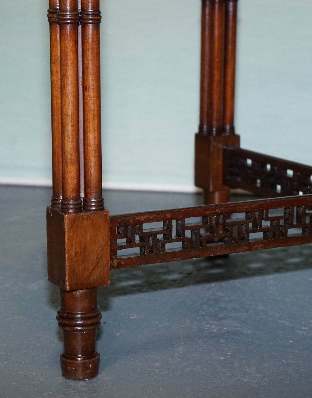 LATE 19TH CENTURY CHIPPENDALE STYLE ROUND OCCASIONAL TABLE AND CARVED STRETCHERS