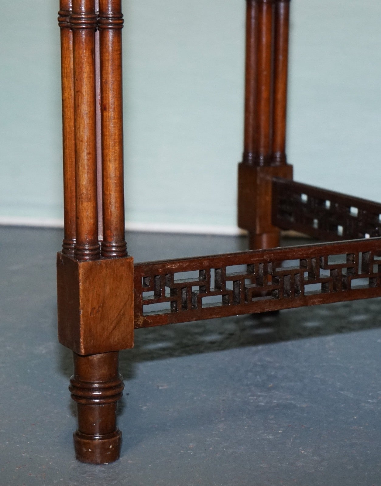 LATE 19TH CENTURY CHIPPENDALE STYLE ROUND OCCASIONAL TABLE AND CARVED STRETCHERS