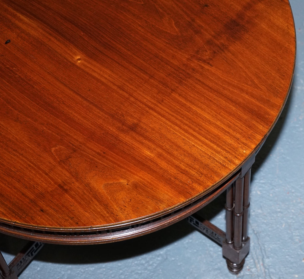 LATE 19TH CENTURY CHIPPENDALE STYLE ROUND OCCASIONAL TABLE AND CARVED STRETCHERS