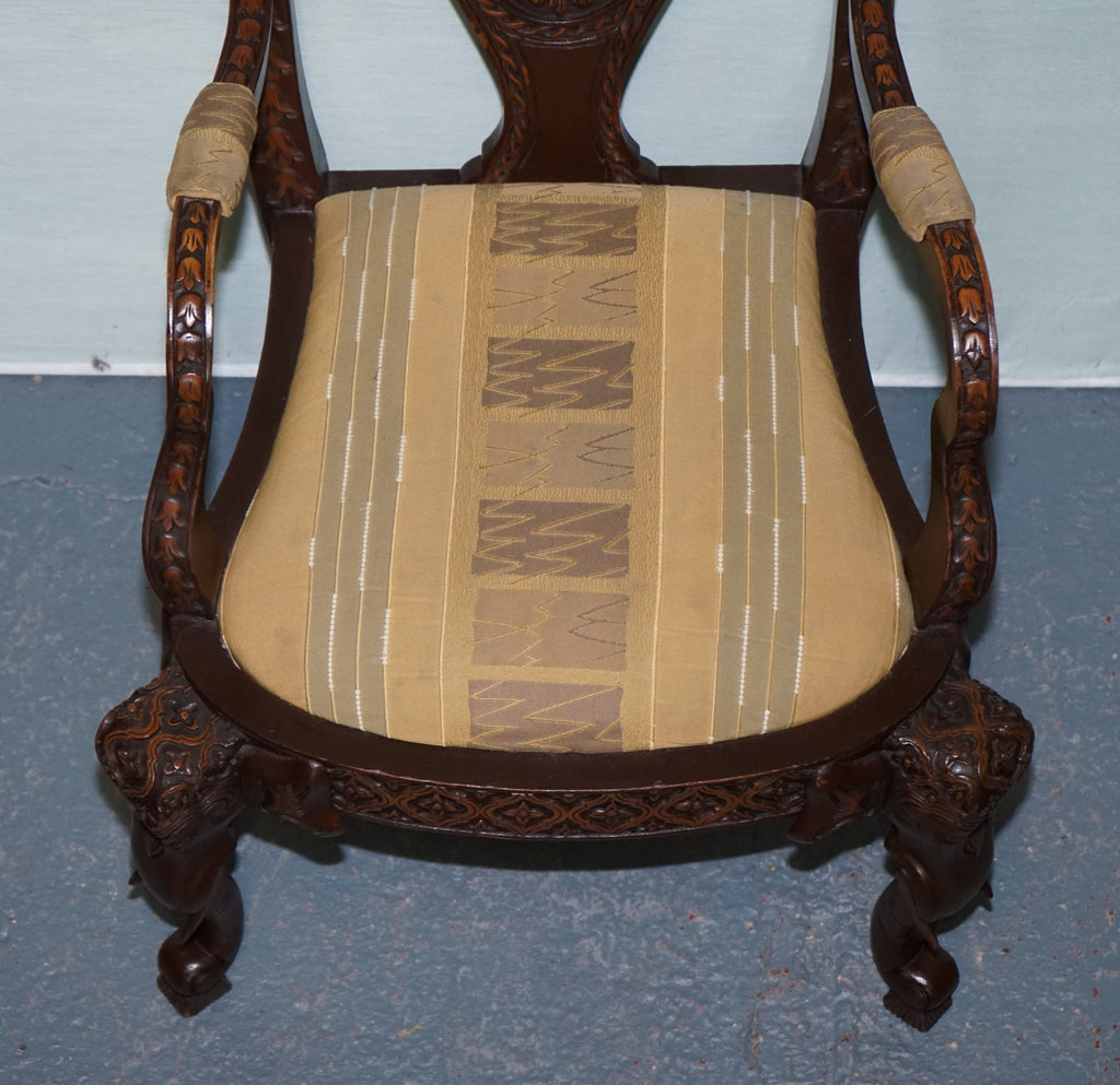ANGLO INDIAN WOODEN HEAVILY CARVED ELEPHANT DETAIL SINGLE CAVER ARMCHAIR