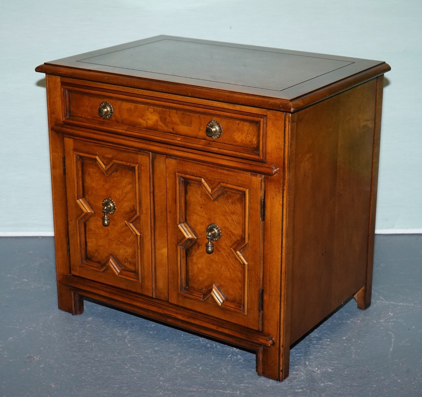 BAKER FURNITURE BURR WALNUT BEDSIDE CABINET WITH DRAWER AND CARVED DOORS