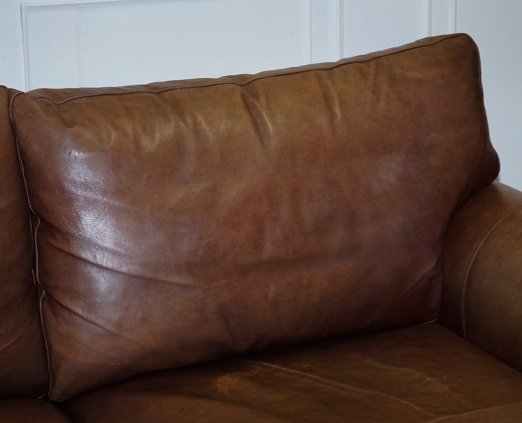 COMFORTABLE BROWN LEATHER TWO TO THREE SEATER SOFA WITH FEATHER BACK CUSHIONS