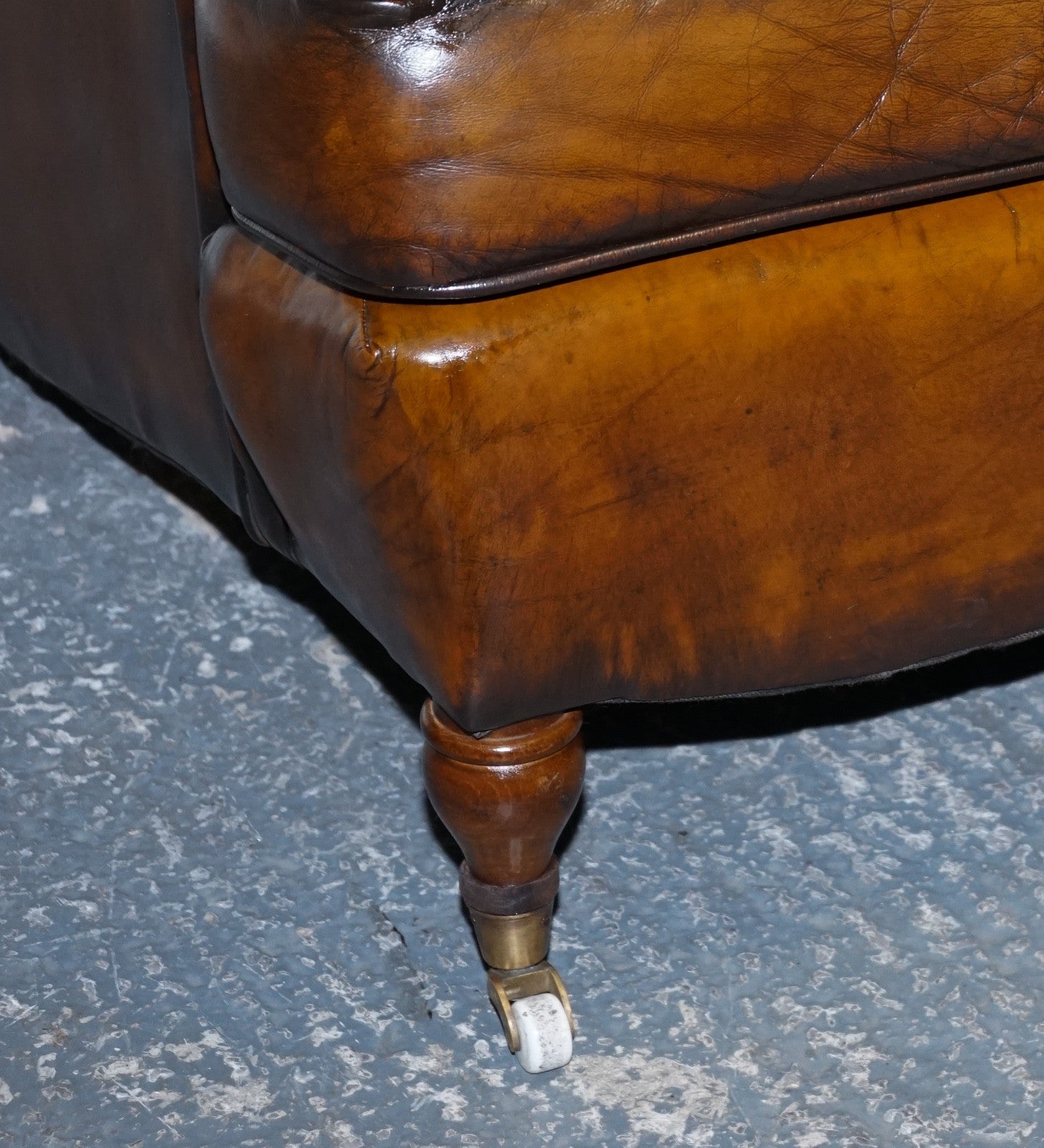 PAIR OF CIGAR HAND DYED LEATHER HOWARD & SONS STYLE ARMCHAIRS ON CASTOR FEET