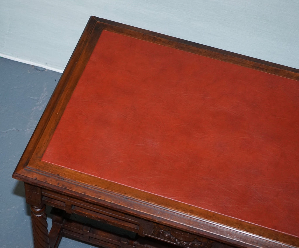 LATE 19TH CENTURY CONTINENTAL CARVED WALNUT WRITING TABLE LEATHER INLAY TOP