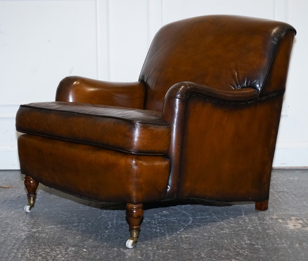 PAIR OF CIGAR HAND DYED LEATHER HOWARD & SONS STYLE ARMCHAIRS ON CASTOR FEET
