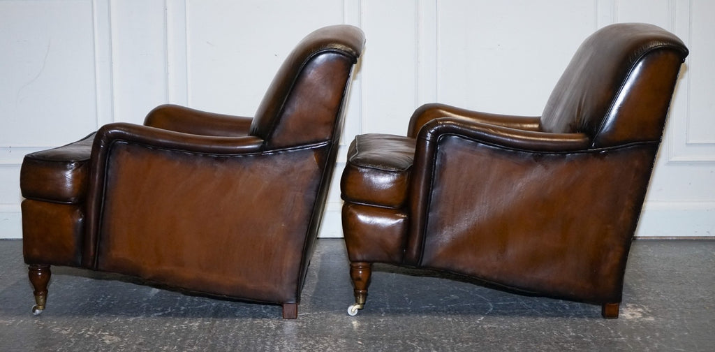 PAIR OF CIGAR HAND DYED LEATHER HOWARD & SONS STYLE ARMCHAIRS ON CASTOR FEET
