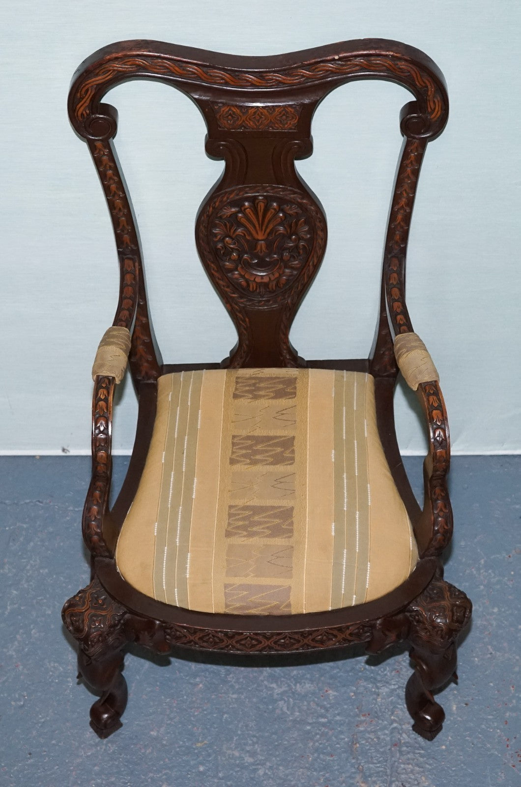 ANGLO INDIAN WOODEN HEAVILY CARVED ELEPHANT DETAIL SINGLE CAVER ARMCHAIR