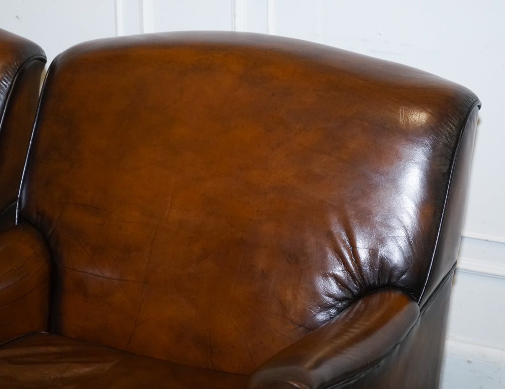 PAIR OF CIGAR HAND DYED LEATHER HOWARD & SONS STYLE ARMCHAIRS ON CASTOR FEET