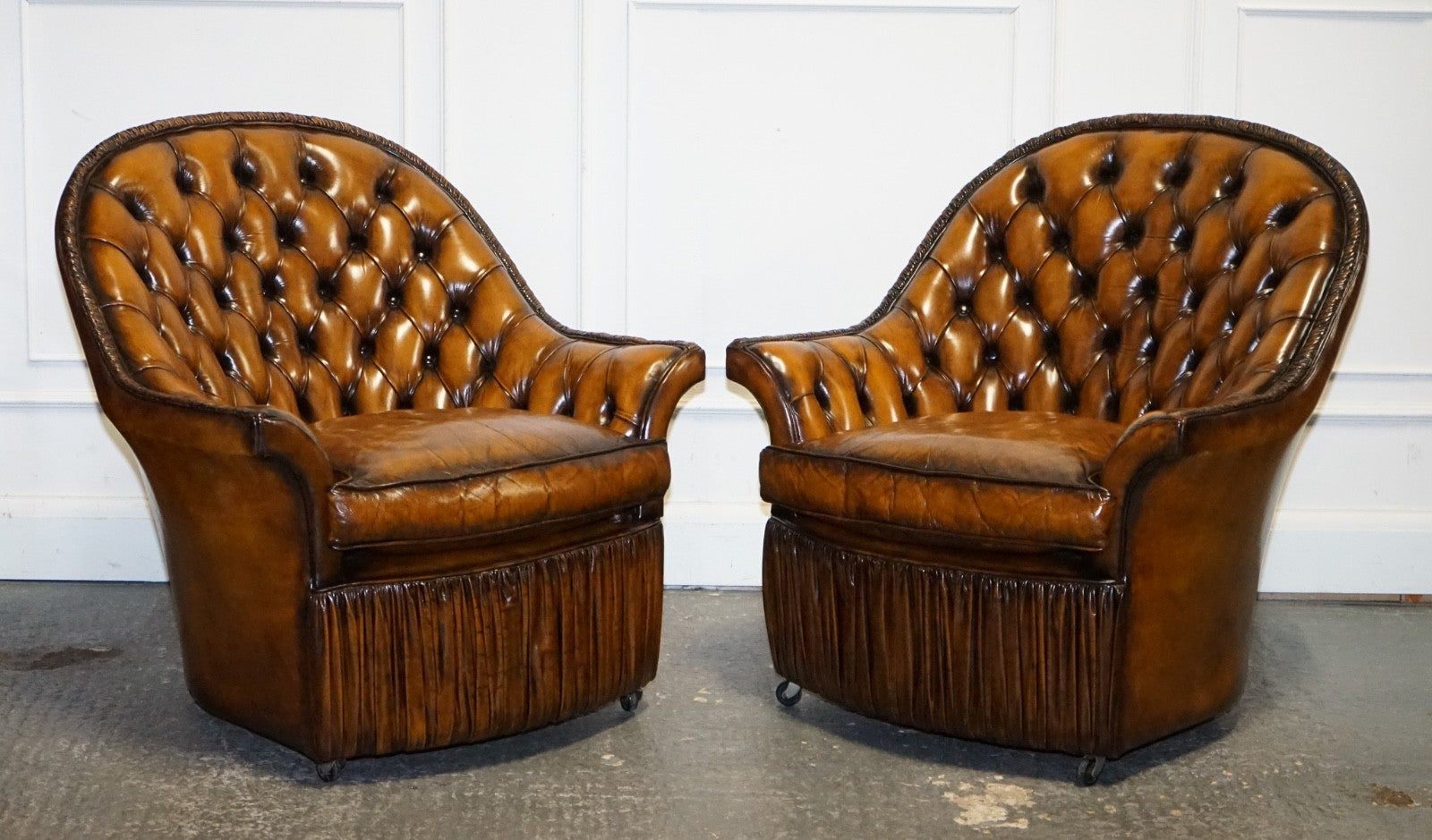 RARE PAIR OF BROWN HAND DYED LEATHER CHESTERFIELD ARMCHAIRS WITH PLEATED FRONT