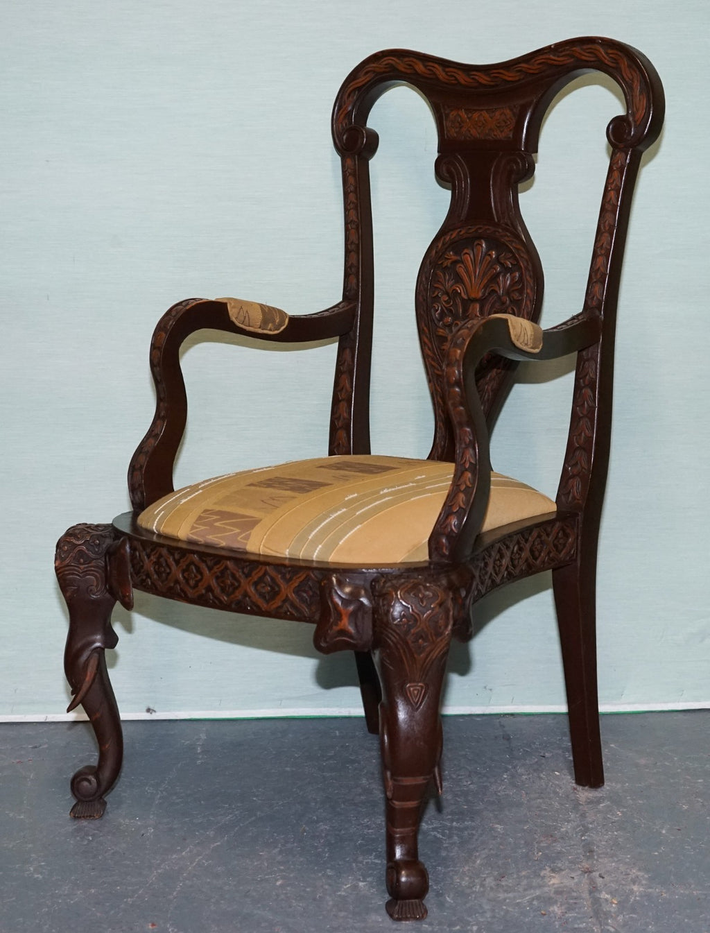 ANGLO INDIAN WOODEN HEAVILY CARVED ELEPHANT DETAIL SINGLE CAVER ARMCHAIR