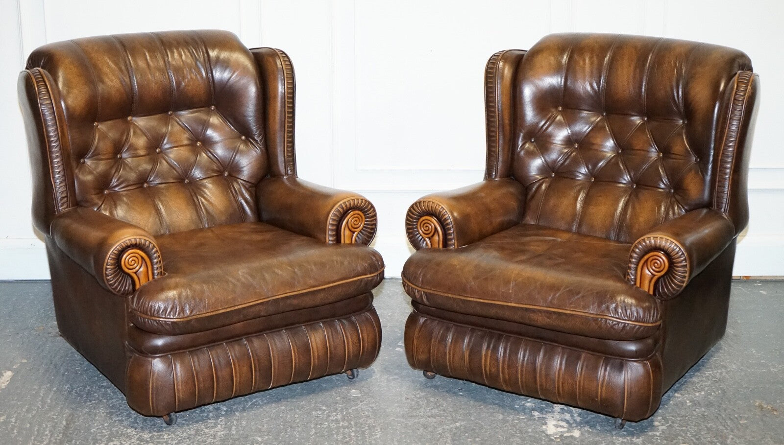 VINTAGE PAIR OF BRITISH MADE BROWN AGED LEATHER MONK CHESTERFIELD ARMCHAIRS