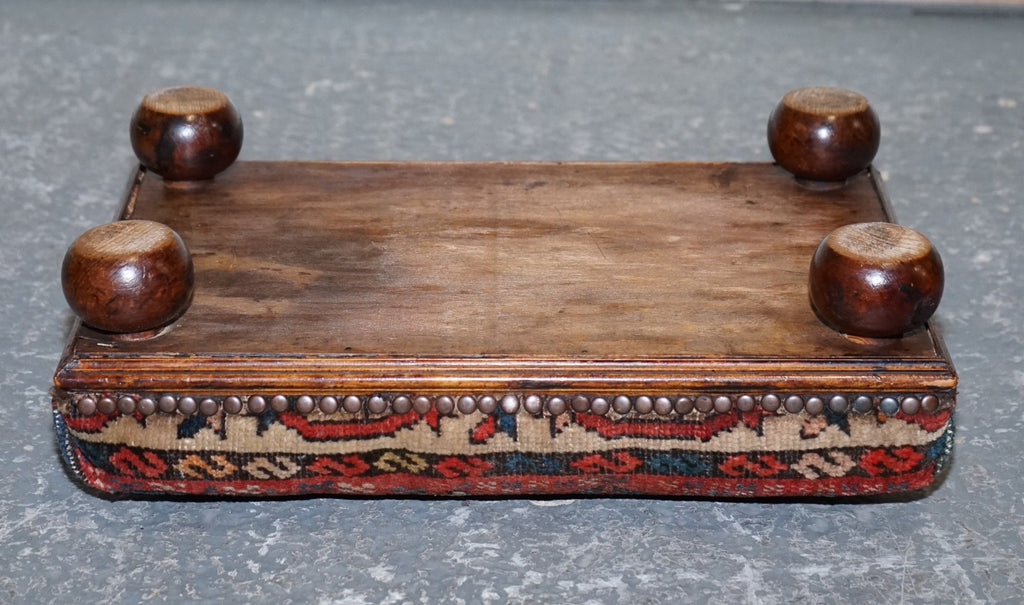 ANTIQUE KILIM TRIBAL RUG UPHOLSTERED FOOTSTOOL RAISED ON BUN FEET WITH STUDS