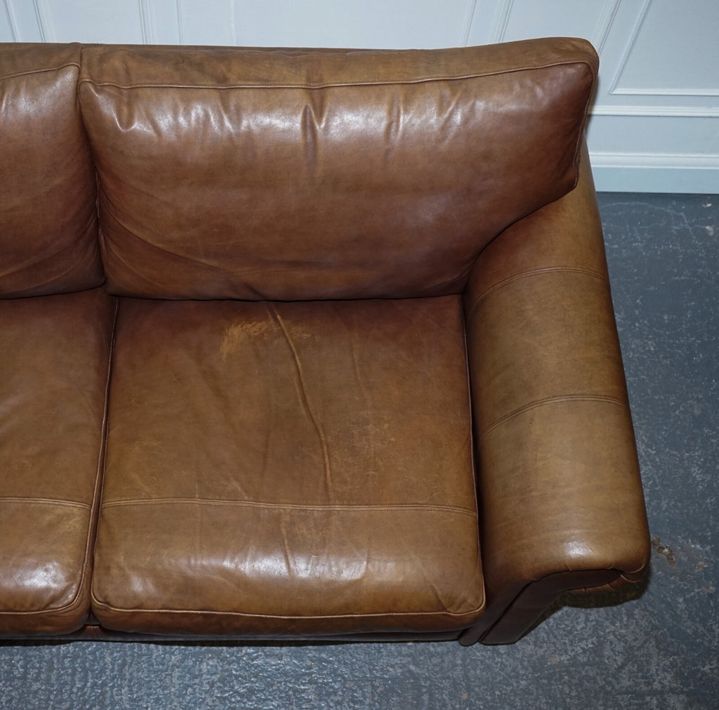 COMFORTABLE BROWN LEATHER TWO TO THREE SEATER SOFA WITH FEATHER BACK CUSHIONS