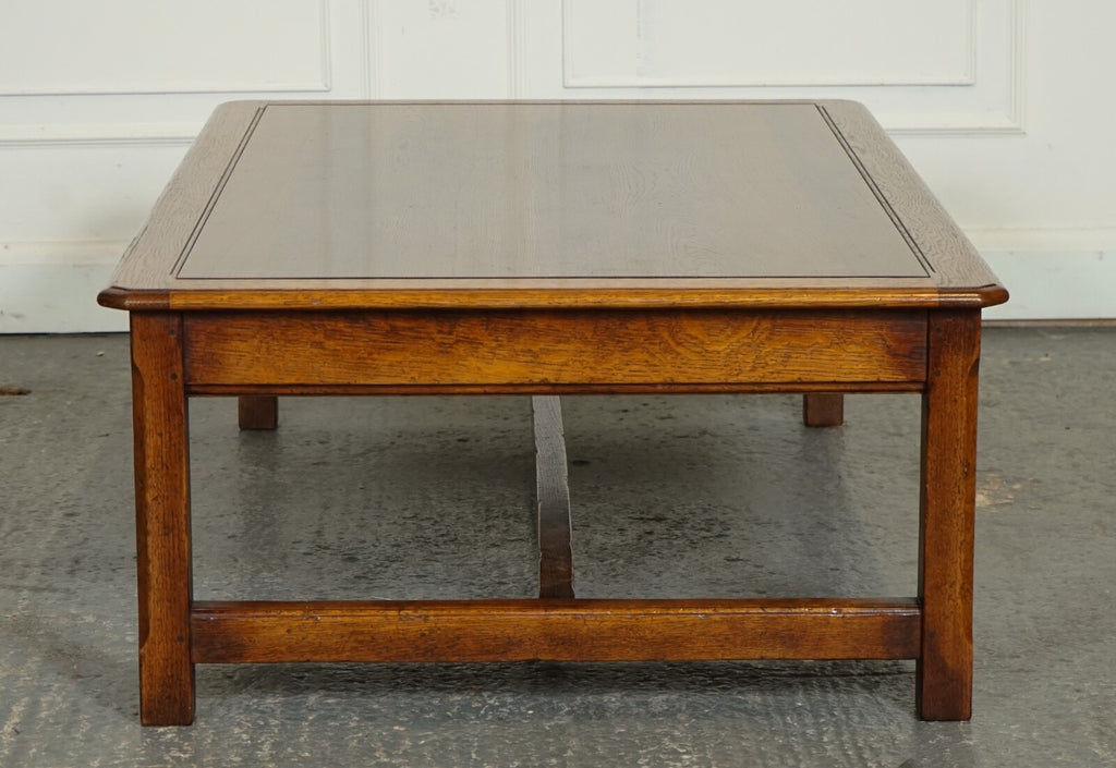 STUNNING LARGE OAK VINTAGE COFFEE TABLE WITH NICE GRAIN OAK TOP AND H FRAME