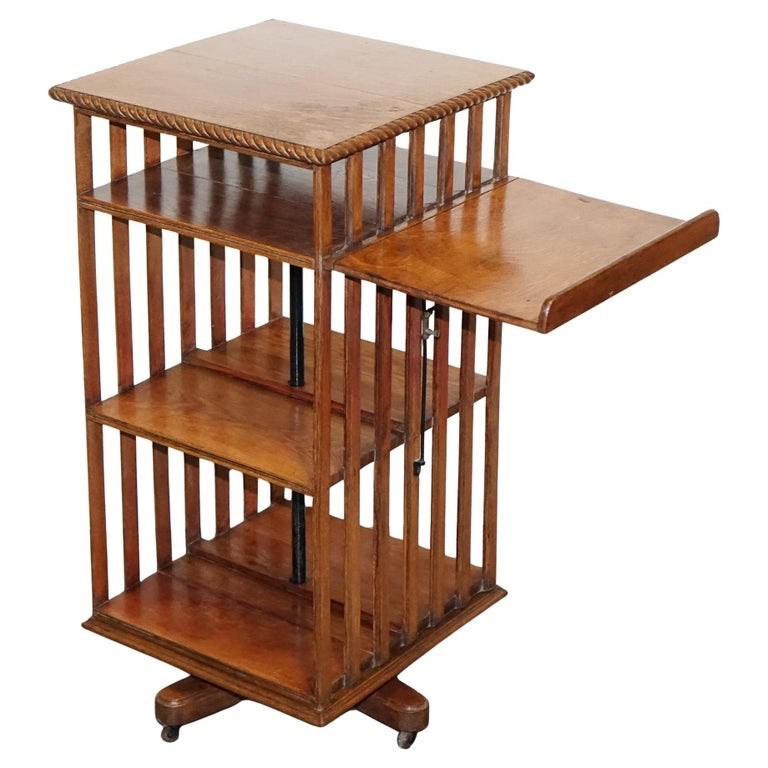 ANTIQUE SUBSTANTIAL OAK REVOLVING BOOKCASE WITH FOLDING READING STAND