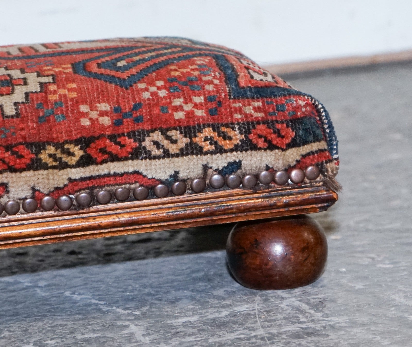 ANTIQUE KILIM TRIBAL RUG UPHOLSTERED FOOTSTOOL RAISED ON BUN FEET WITH STUDS