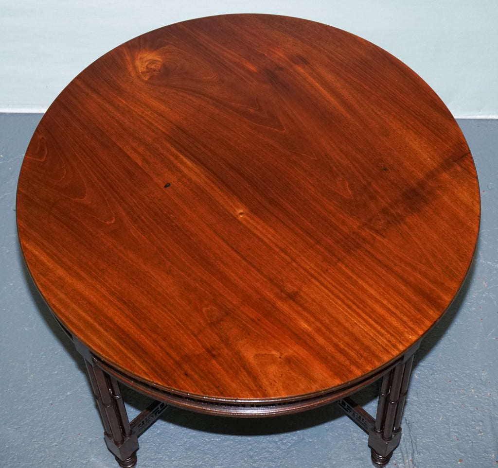 LATE 19TH CENTURY CHIPPENDALE STYLE ROUND OCCASIONAL TABLE AND CARVED STRETCHERS