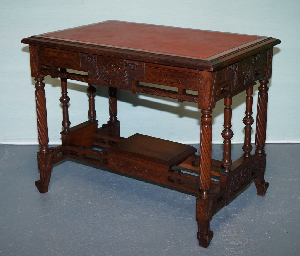 LATE 19TH CENTURY CONTINENTAL CARVED WALNUT WRITING TABLE LEATHER INLAY TOP