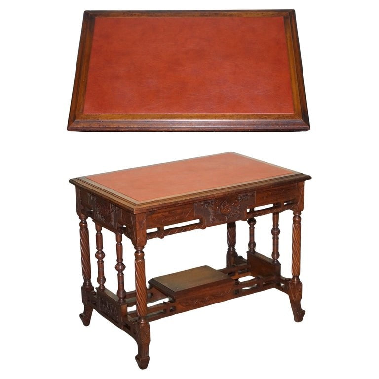 LATE 19TH CENTURY CONTINENTAL CARVED WALNUT WRITING TABLE LEATHER INLAY TOP