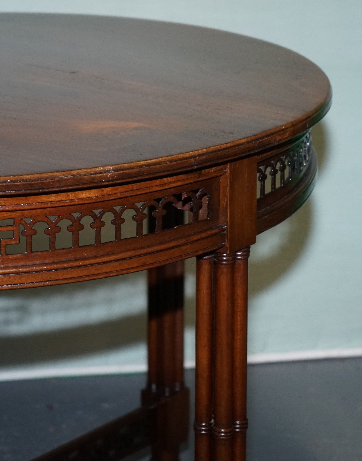 LATE 19TH CENTURY CHIPPENDALE STYLE ROUND OCCASIONAL TABLE AND CARVED STRETCHERS