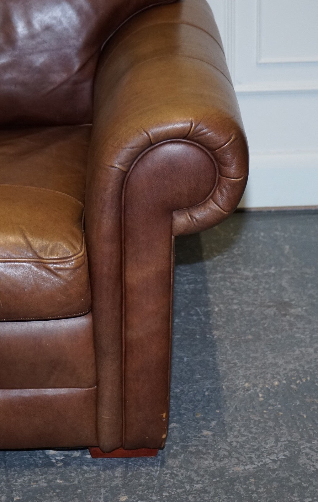 COMFORTABLE BROWN LEATHER TWO TO THREE SEATER SOFA WITH FEATHER BACK CUSHIONS