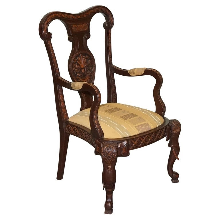 ANGLO INDIAN WOODEN HEAVILY CARVED ELEPHANT DETAIL SINGLE CAVER ARMCHAIR