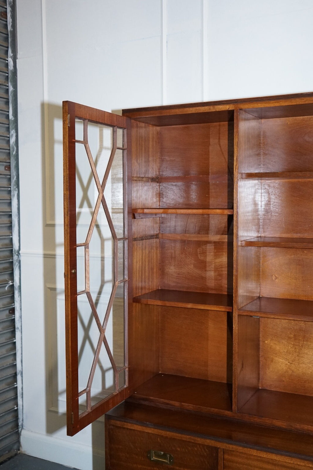 VINTAGE BEVAN FUNNELL MILITARY CAMPAIGN BOOKCASE WITH EMBOSSED LEATHER DOORS