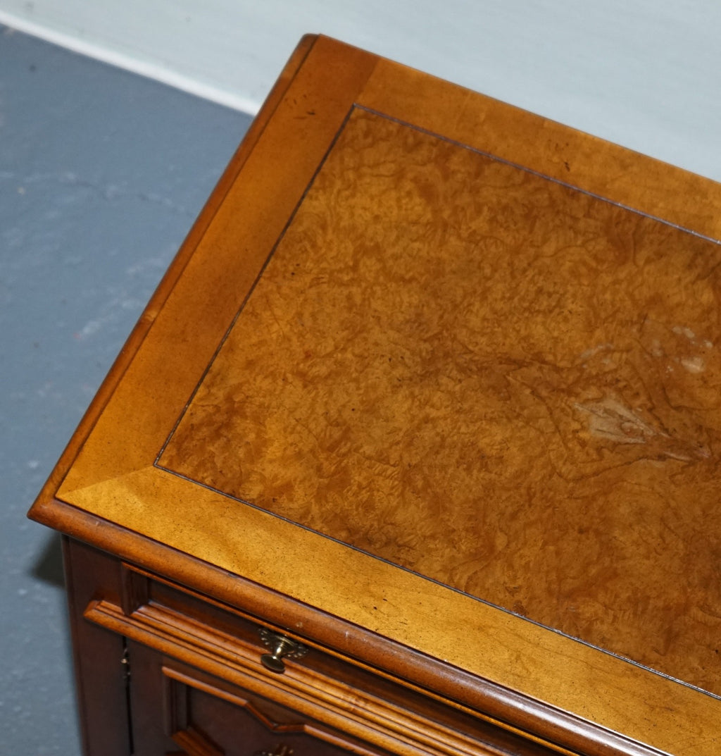 BAKER FURNITURE BURR WALNUT BEDSIDE CABINET WITH DRAWER AND CARVED DOORS