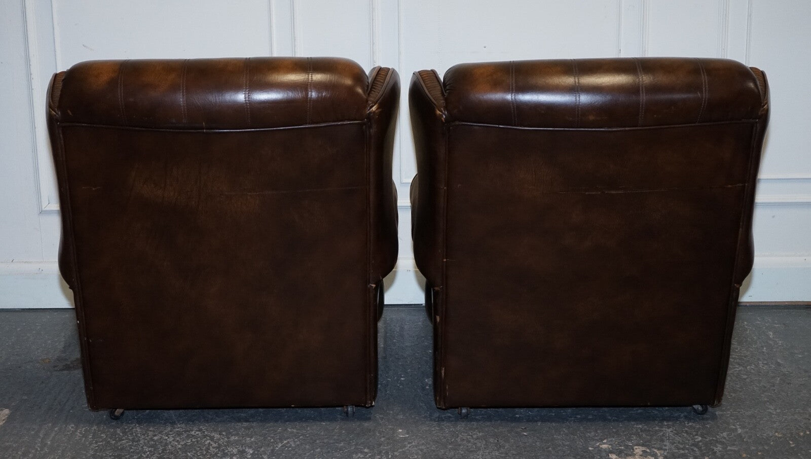 VINTAGE PAIR OF BRITISH MADE BROWN AGED LEATHER MONK CHESTERFIELD ARMCHAIRS