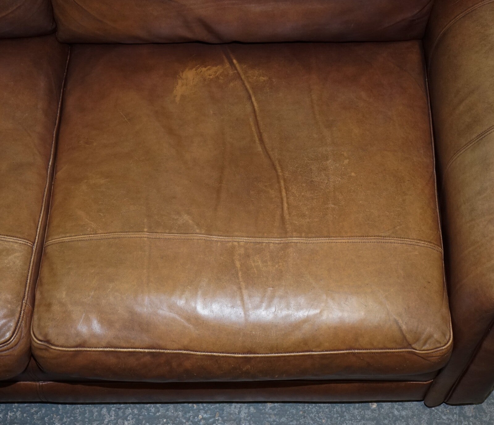 COMFORTABLE BROWN LEATHER TWO TO THREE SEATER SOFA WITH FEATHER BACK CUSHIONS