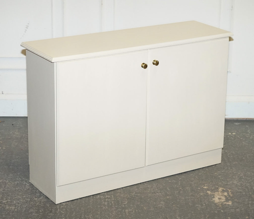 MINIMALIST PAINTED WHITE CUPBOARD WITH BRASS KNOBS MATCHING TABLES AVAILABLE