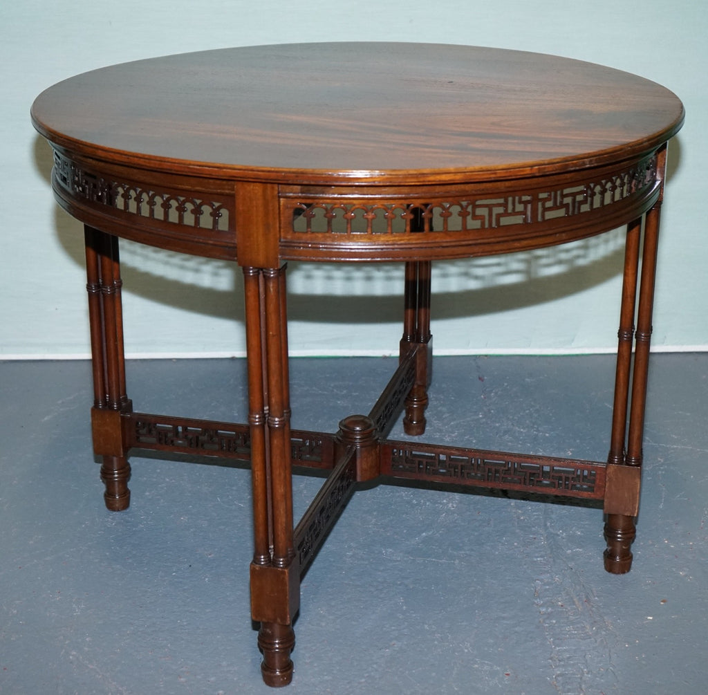LATE 19TH CENTURY CHIPPENDALE STYLE ROUND OCCASIONAL TABLE AND CARVED STRETCHERS