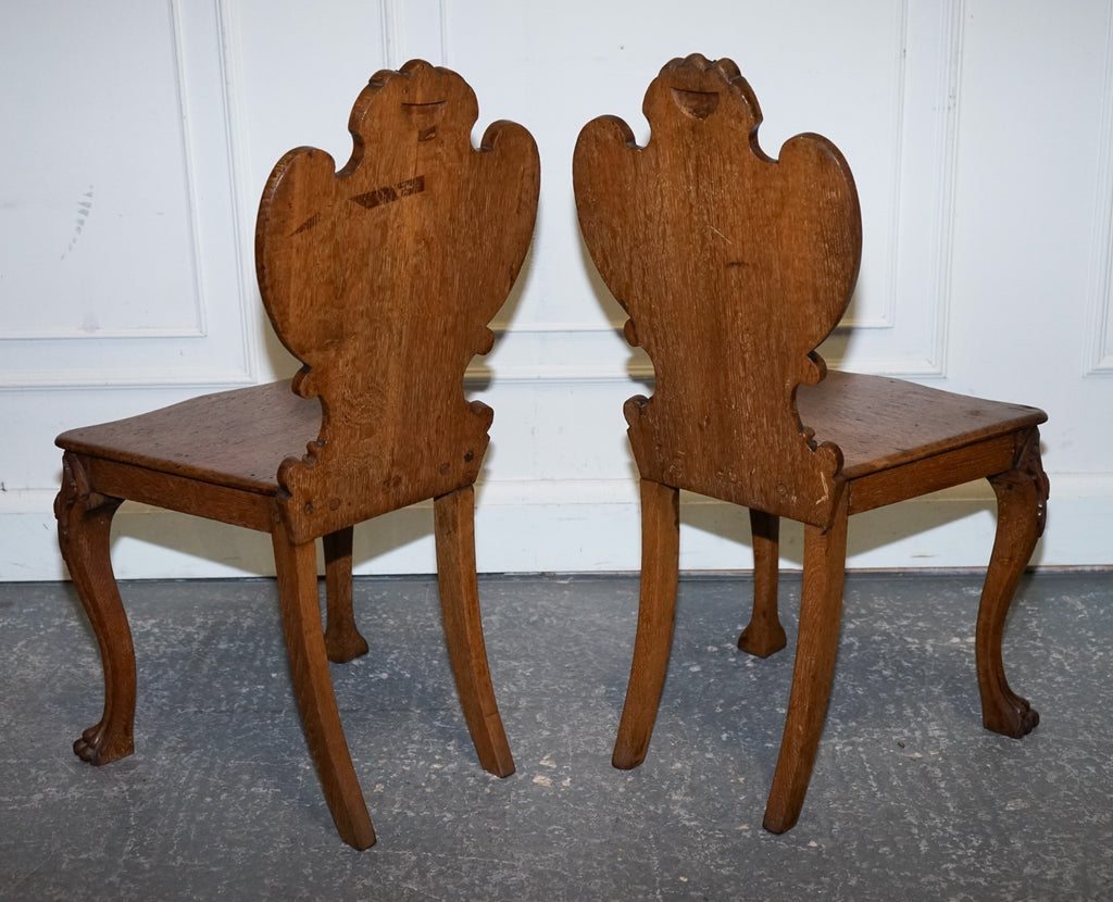 ANTIQUE PAIR OF VICTORIAN SOLID OAK CARVED HALLWAY CHAIRS WITH LION PAW FEET
