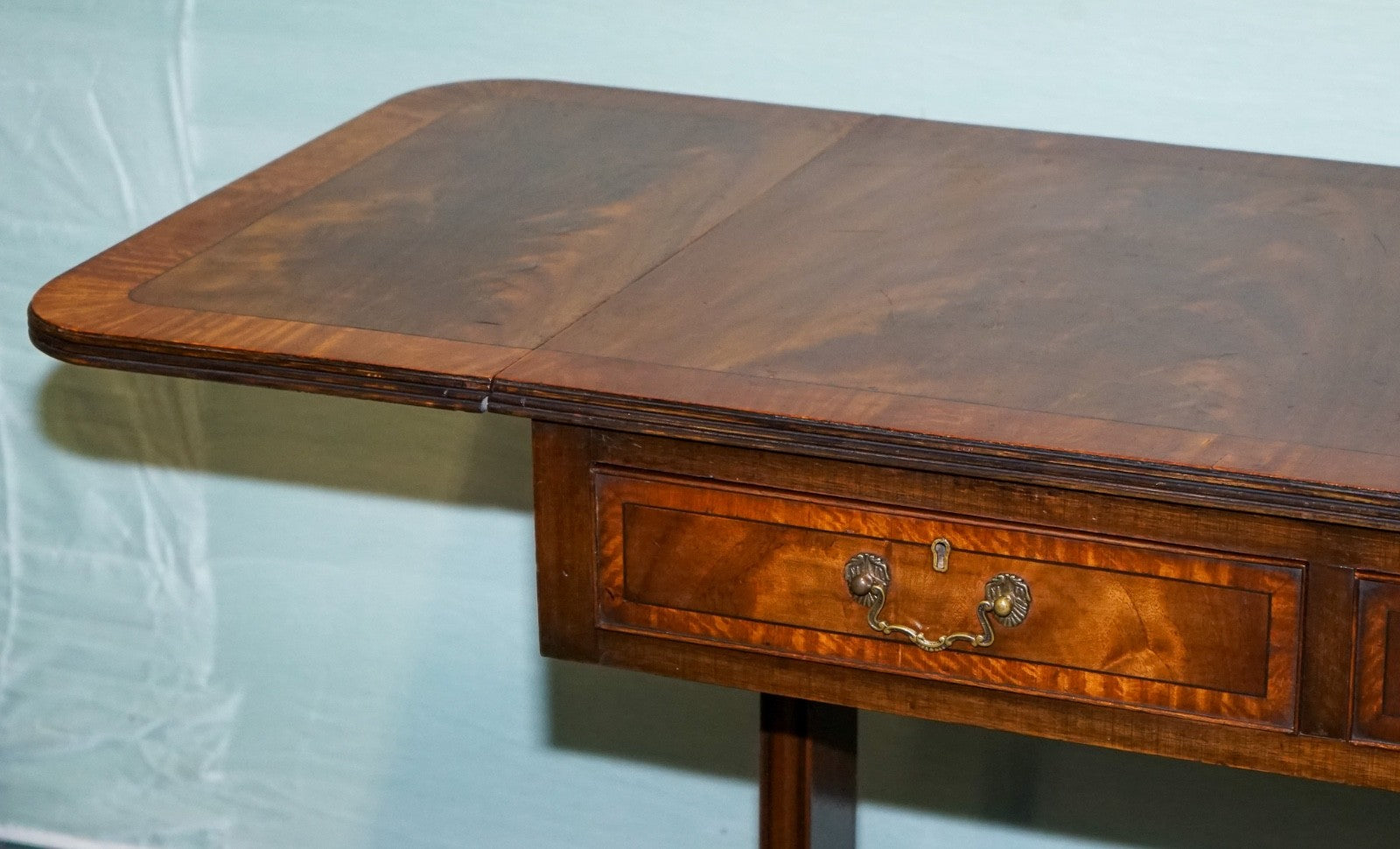 VINTAGE HARDWOOD DROP LEAF SIDE TABLE WITH SABER LEGS AND BRASS PAW FEET
