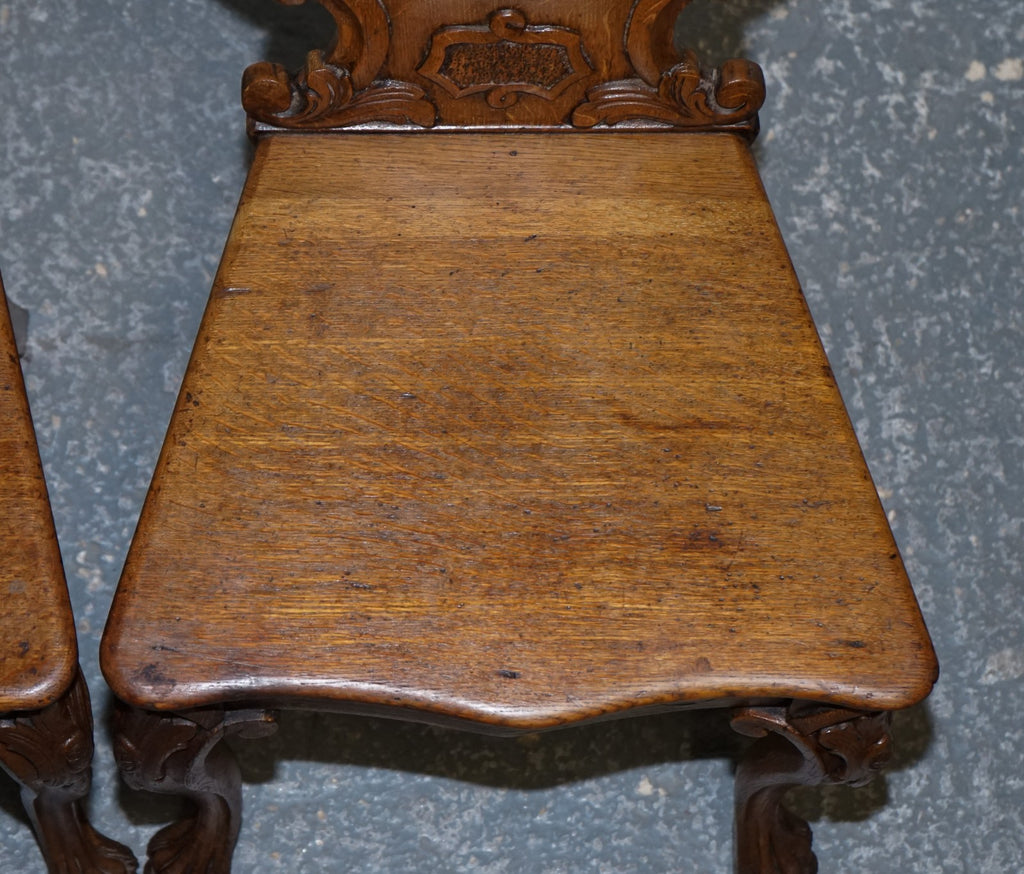 ANTIQUE PAIR OF VICTORIAN SOLID OAK CARVED HALLWAY CHAIRS WITH LION PAW FEET