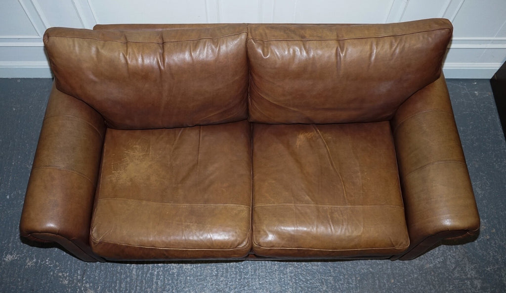 COMFORTABLE BROWN LEATHER TWO TO THREE SEATER SOFA WITH FEATHER BACK CUSHIONS