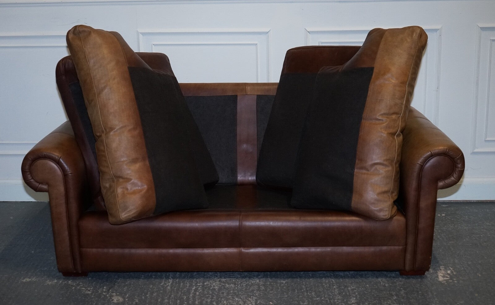 COMFORTABLE BROWN LEATHER TWO TO THREE SEATER SOFA WITH FEATHER BACK CUSHIONS