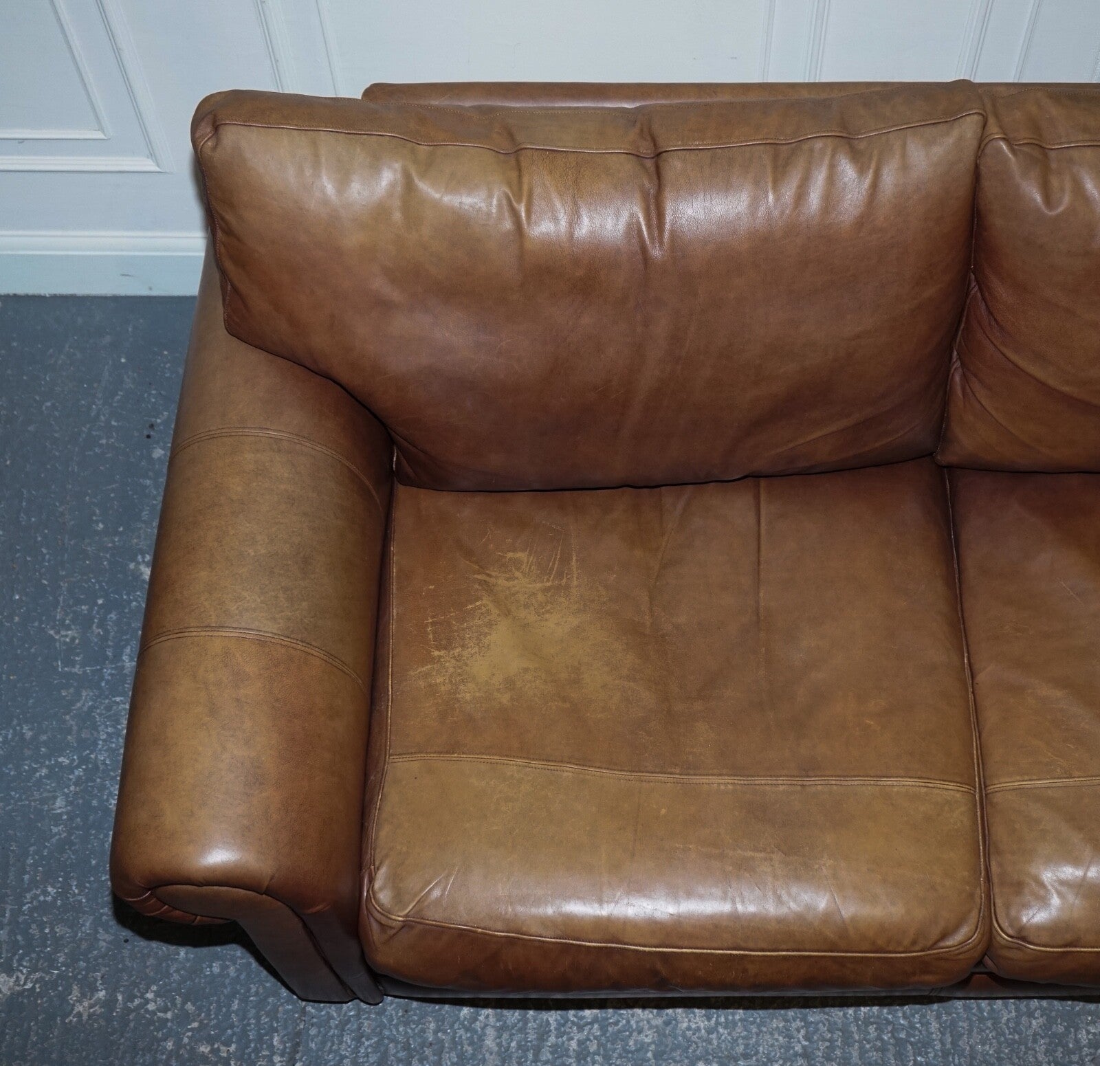 COMFORTABLE BROWN LEATHER TWO TO THREE SEATER SOFA WITH FEATHER BACK CUSHIONS