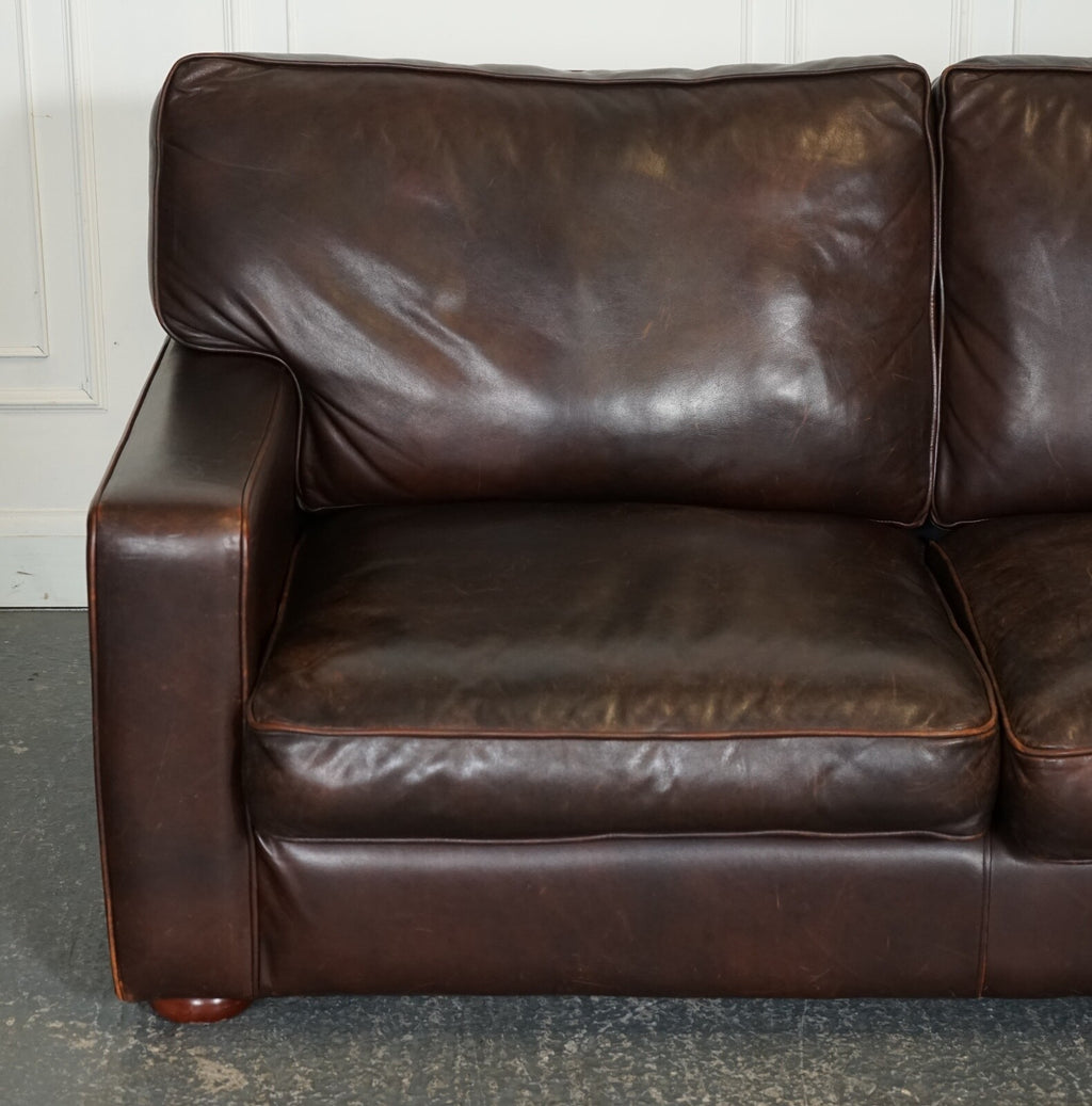 VINTAGE DISTRESSED BROWN LEATHER TWO TO THREE SEATER SOFA
