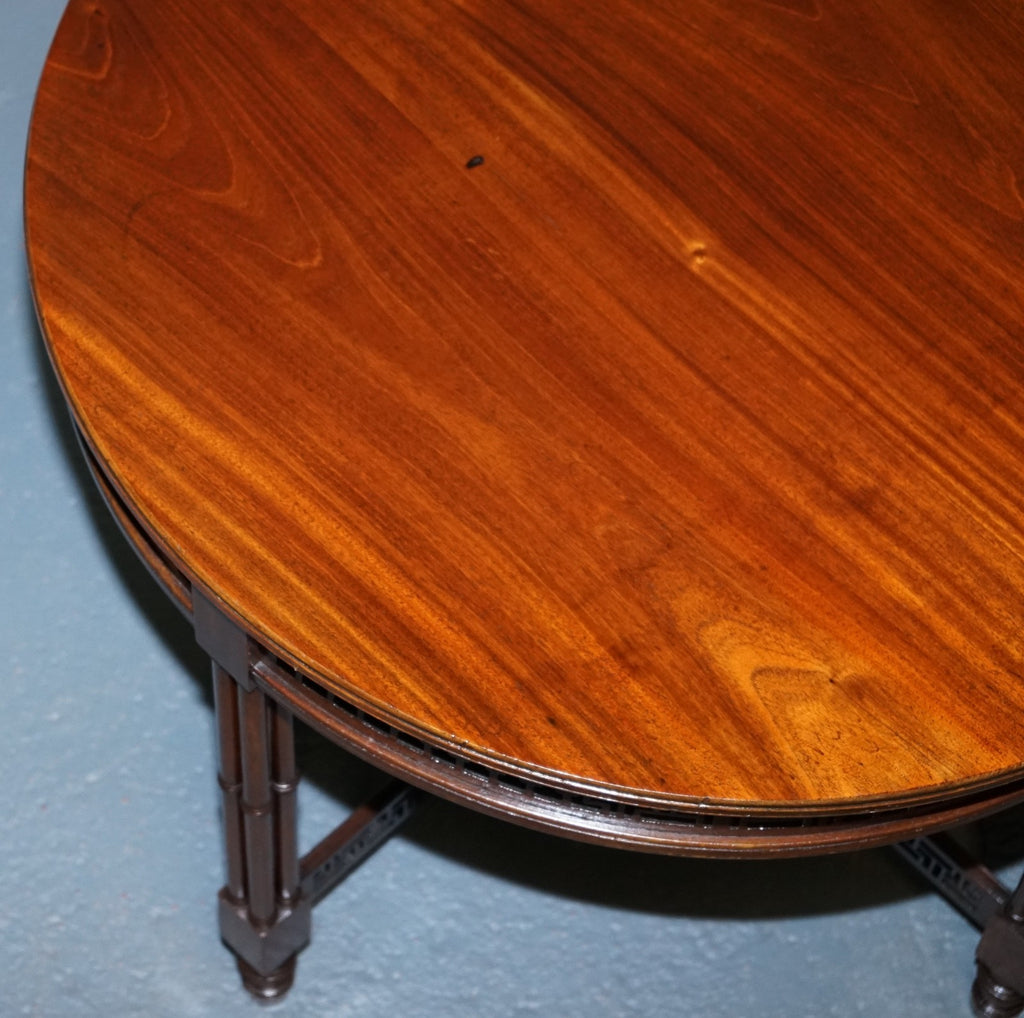 LATE 19TH CENTURY CHIPPENDALE STYLE ROUND OCCASIONAL TABLE AND CARVED STRETCHERS