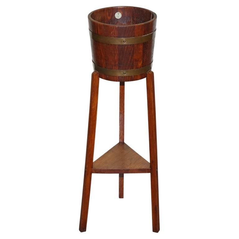 ANTIQUE EDWARDIAN OAK PLANT OR CHAMPAGNE STAND BY R.A. LISTER & CO ENGLAND