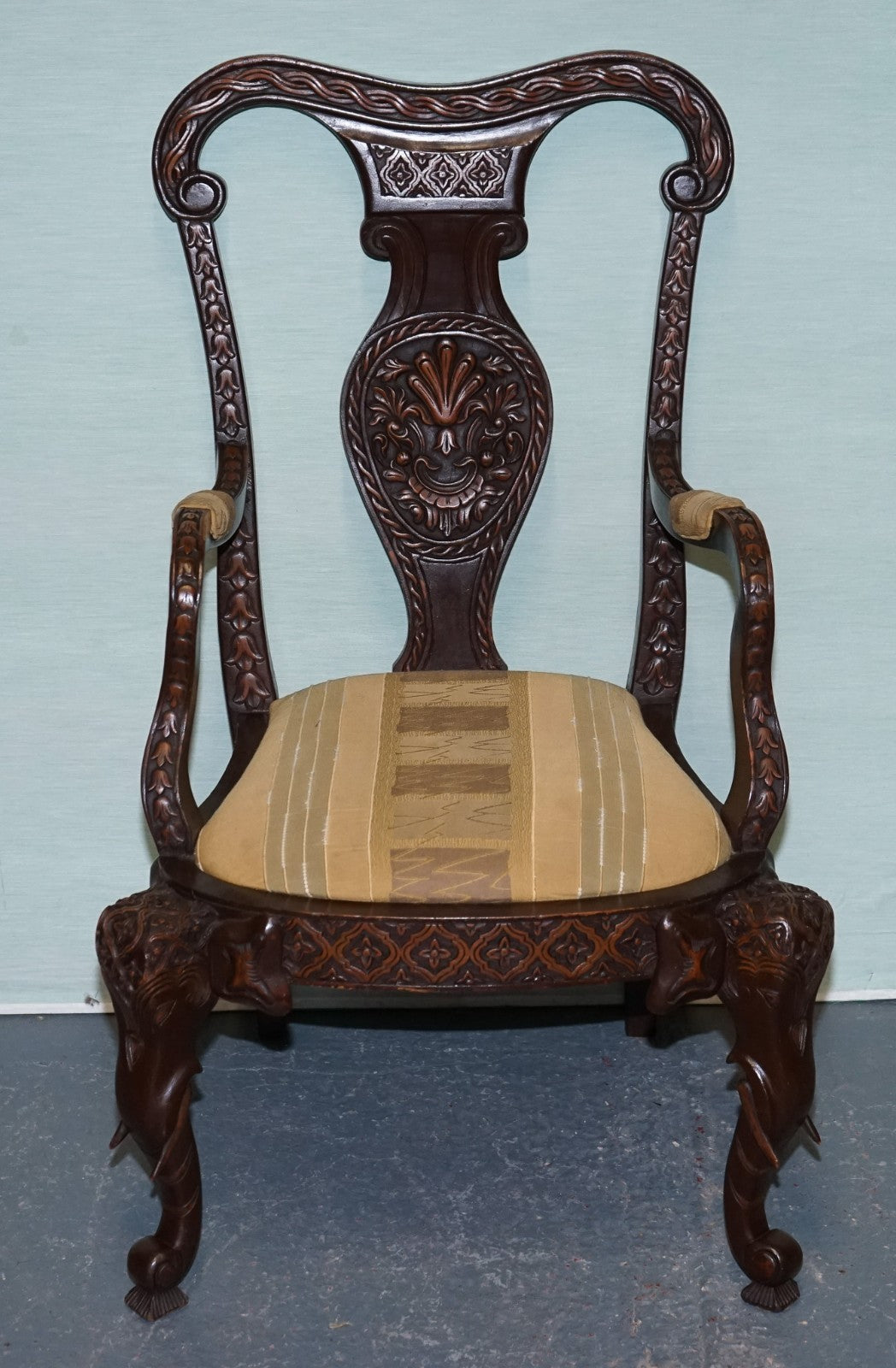 ANGLO INDIAN WOODEN HEAVILY CARVED ELEPHANT DETAIL SINGLE CAVER ARMCHAIR