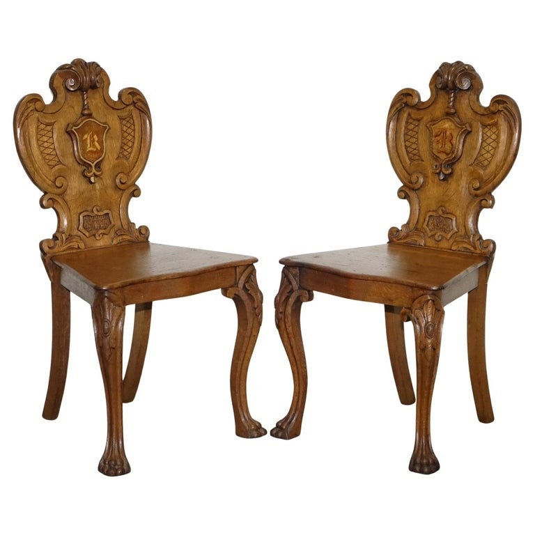 ANTIQUE PAIR OF VICTORIAN SOLID OAK CARVED HALLWAY CHAIRS WITH LION PAW FEET